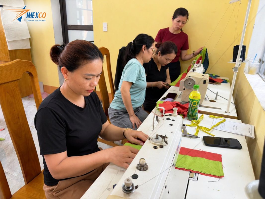 Participants learn fabric-cutting techniques, one of the essential practical skills that enables local women to actively preserve and develop community costumes